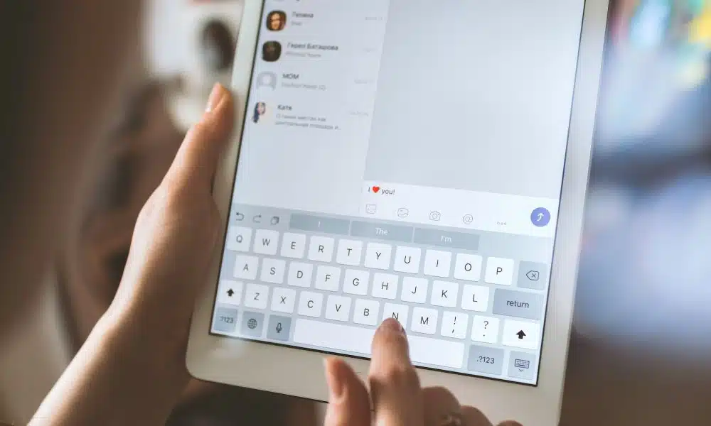 person using white iPad