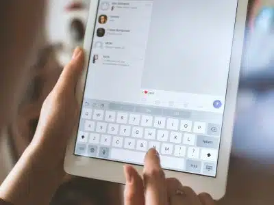 person using white iPad