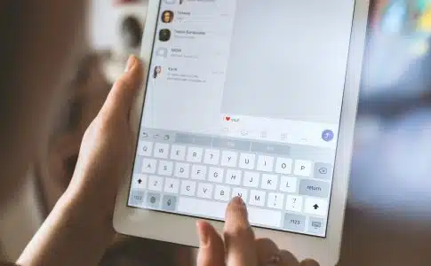 person using white iPad